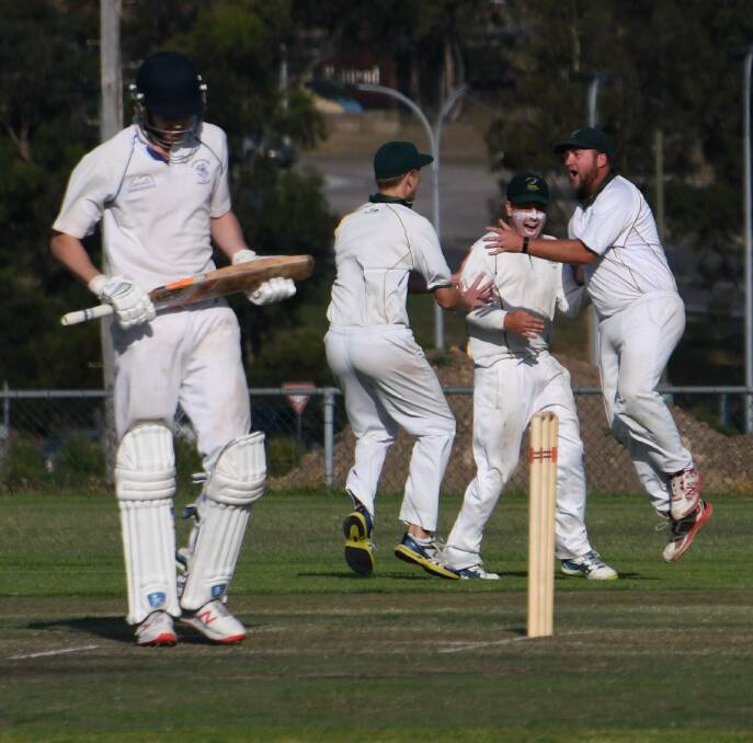 CELEBRATION: Western Suburbs players celebrate after co-skipper Tom Irwin took a diving catch to dismiss Eastern Suburbs batsman Trent Park in their round four encounter. Picture: Michael Hartshorn