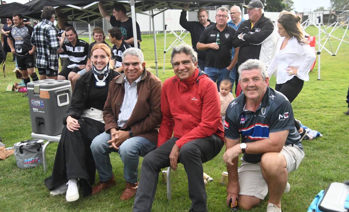 Kyrah Sager, who broke her neck in a recent Rugby 7s game, with former Wallabies Gary and Glen Ella and John Muggleton on the sidelines at Marcellin Park on Saturday.