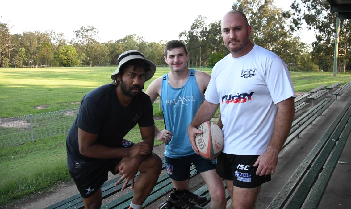 ENTHUSIASTIC: Young recruits Ramsey Bukavaru and Jayden Morrison with East Maitland Rugby Club original Adam Hewitt who played 110 games with the Eagles. Picture: Michael Hartshorn