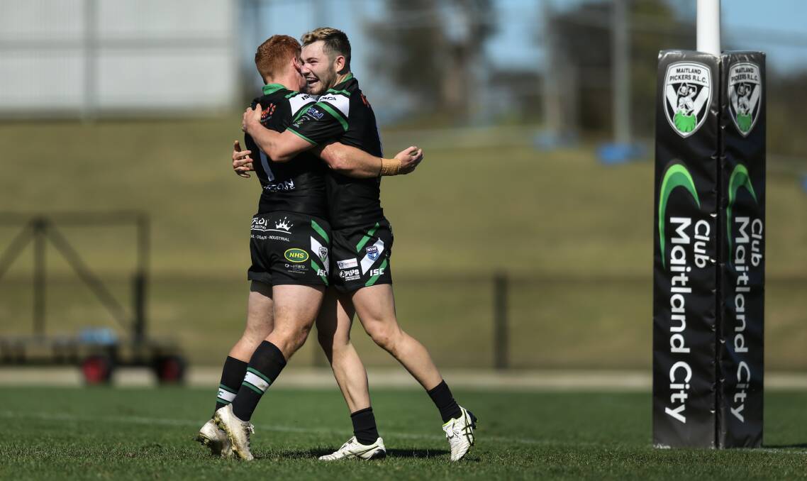 Chad O'Donnell and Dan Langbridge celebrate after O'Donnell scores a try. Picture: Marina Neil