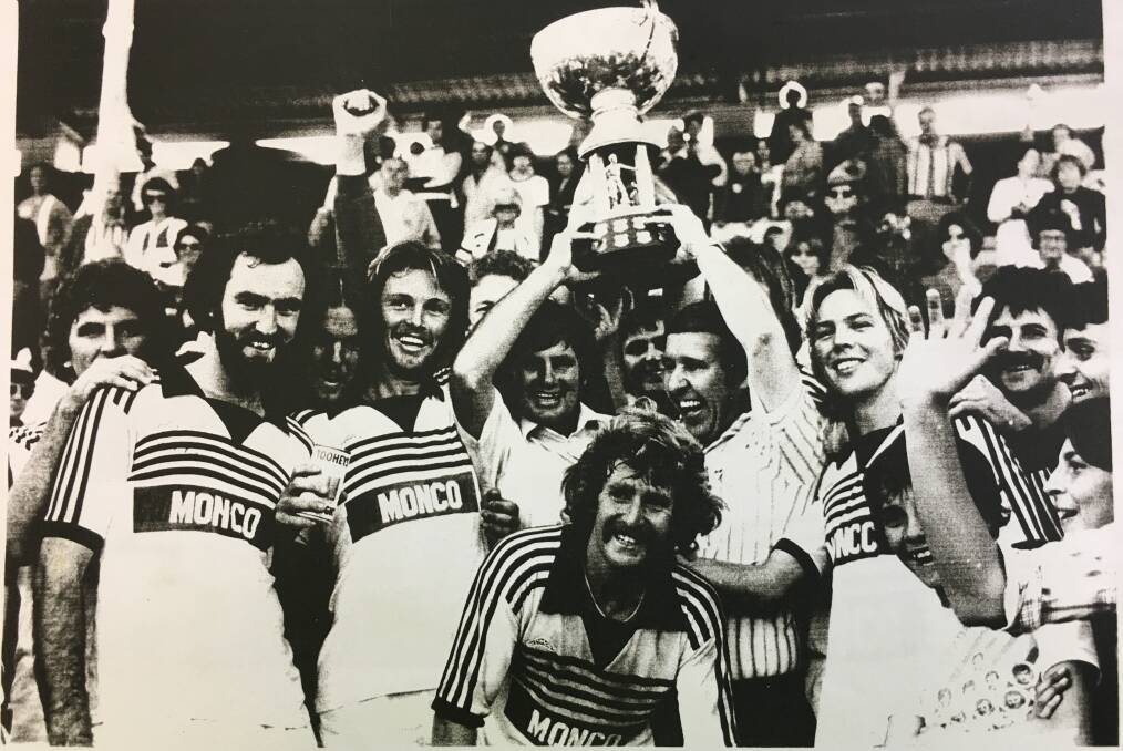 FAMILY CONNECTION: Nick Cowburn's father Brett (left) and and his uncle John (right) celebrate winning the 1980 grand final with the Magpies.