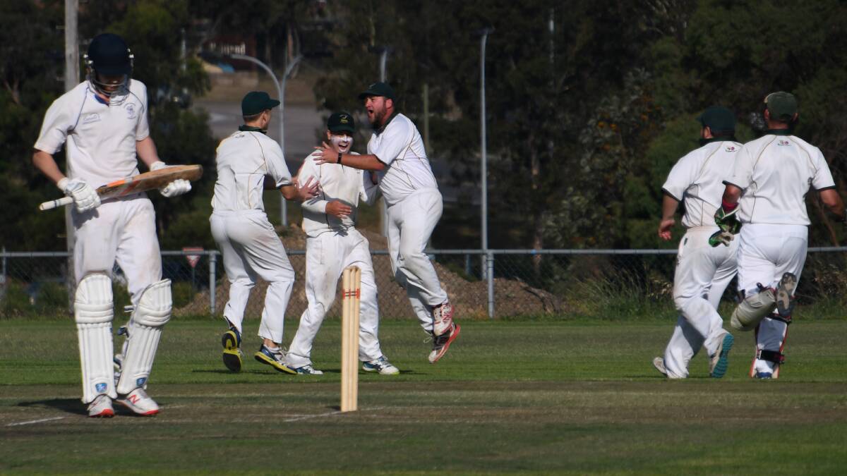 CELEBRATION: Western Suburbs players celebrate after co-skipper Tom Irwin took a diving catch to dismiss Eastern Suburbs batsman Trent Park. Picture: Michael Hartshorn
