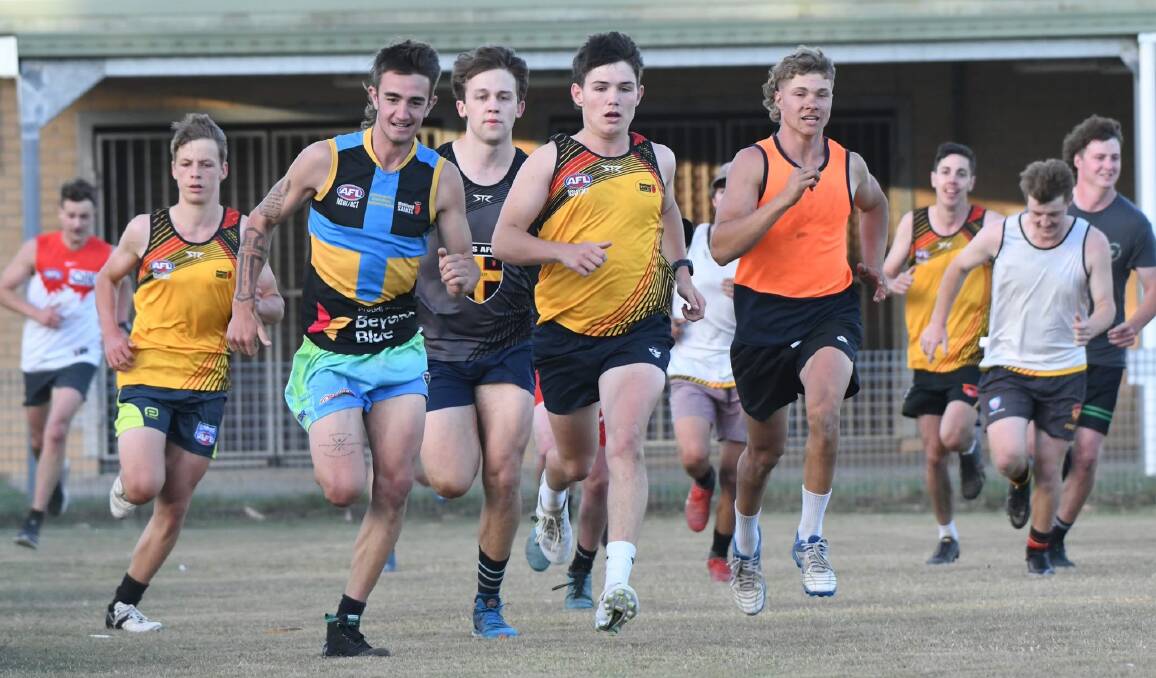 Lucas Doherty, Wally Pankhurst, Riley Newstead, Xavier Russell and Riley Hawes lead a sprint session during preseason training at Lochinvar. Picture by Grant Power.
