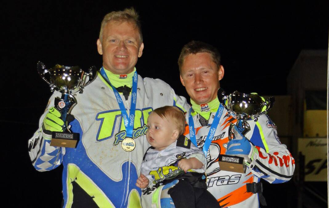 TITLE WIN: Darrin Treloar and Blake Cox with his child. Picture: Courtesy P&M Galloway