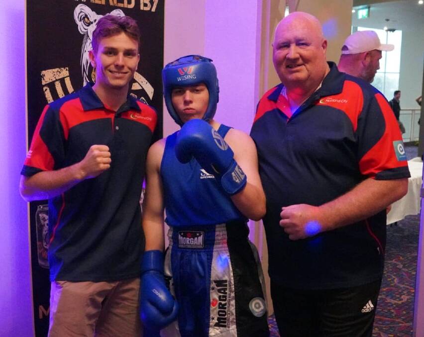 MEDALS: Maitland fighters Willem Clarke and Blake Stone with their trainer Barry McDonald. Picture: Final Round Promotion.