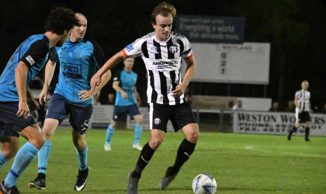 Weston Bears player Chris Hurley takes on the Magpies defence in the first leg of the local derby. Picture: Michael Hartshorn