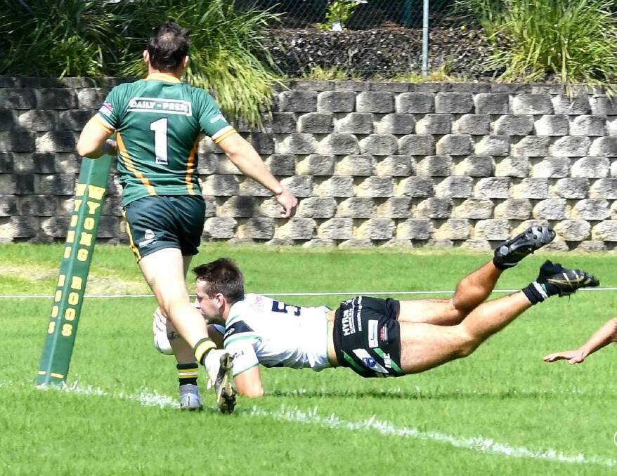 GOOD FORM: Maitland's James Bradley dives into score a try against Wyong. Picture: Amanda Hafey