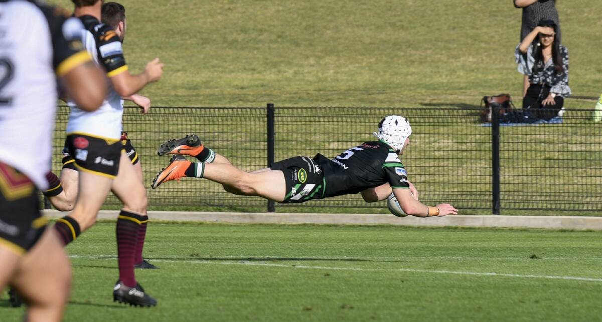 Matt Soper-Lawler dives into score a try after racing 50 metres down the sideline. Picture: Smart Artist
