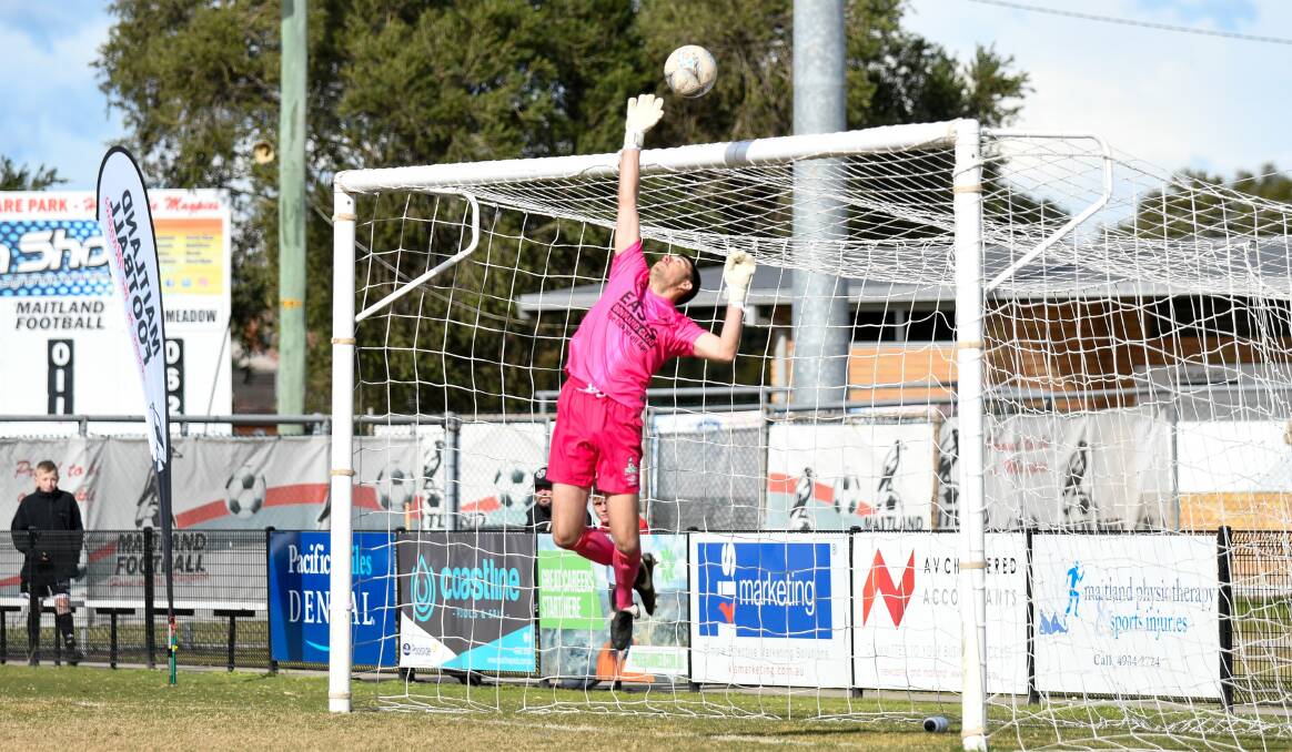 SAFE HANDS: Maitland keeper Matt Trotts tips a shot over the cross bar during the 0-all draw against Broadmeadow Magic.