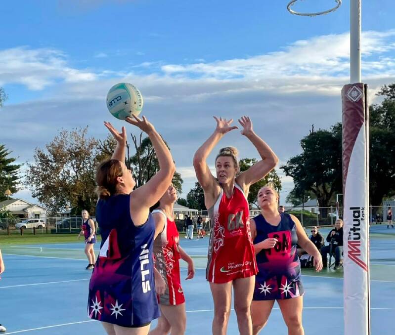ON TARGET: Hills Solicitors goal shooter Mel Morris shoots for goal against Club Maitland City on Saturday. Picture: Maitland Netball Association