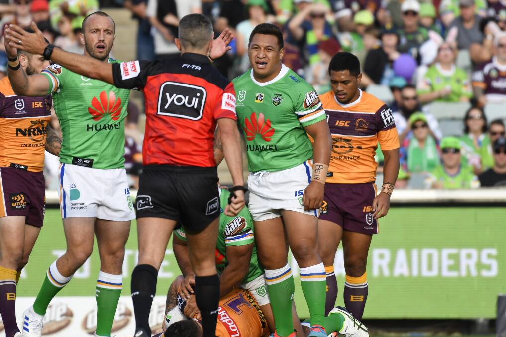ARE YOU SURE SIR?: Canberra players question a referees decision in a game against Brisbane.