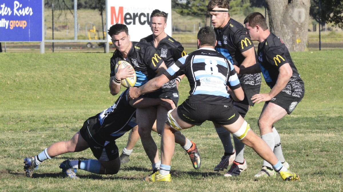 BLACK WAVE: Maitland's Jono Maloney take the ball forward with three teammates in support to maintain the Blacks high-tempo attacking game. 