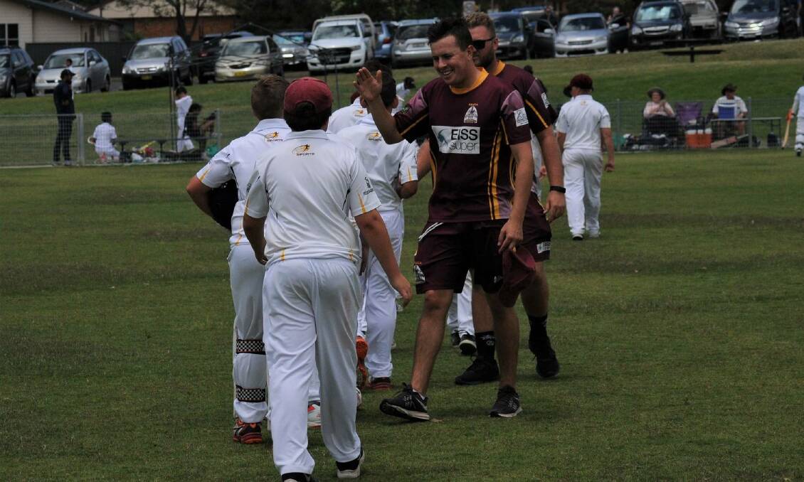 Maitland under-12 IDCA coaches Tom Irwin and Mitch Fisher congratulate their young team on their opening-round win.