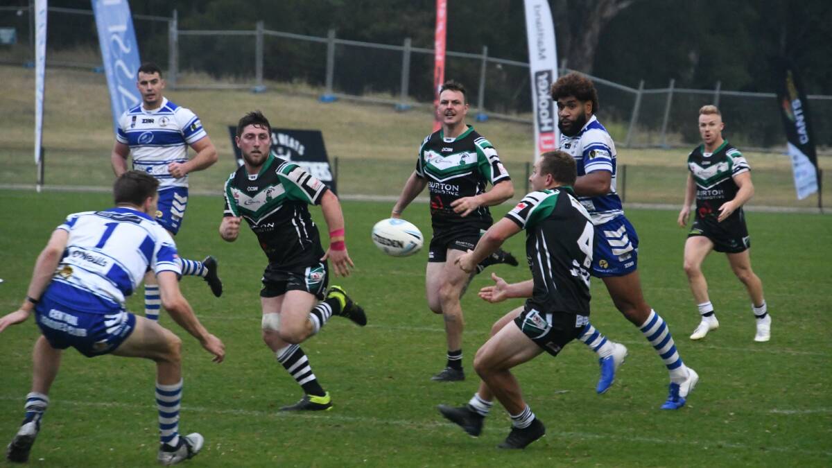 CLEVER: Jarrod Smith runs on to a Frazer Price pass to break the line and score a try for the Pickers against Central Newcastle. Picture: Michael Hartshorn