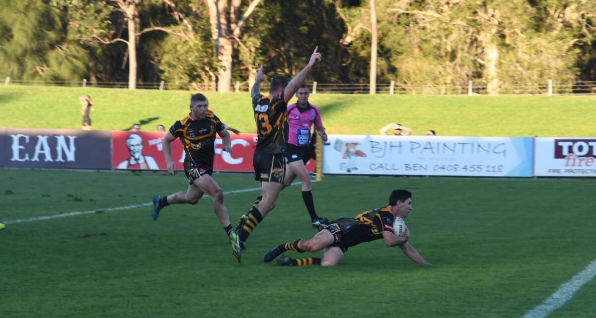 TRY TIME:Paul Carter celebrates as teammate Nick Lawrence scores the match-clinching try for the Goannas. Picture: Michael Hartshorn