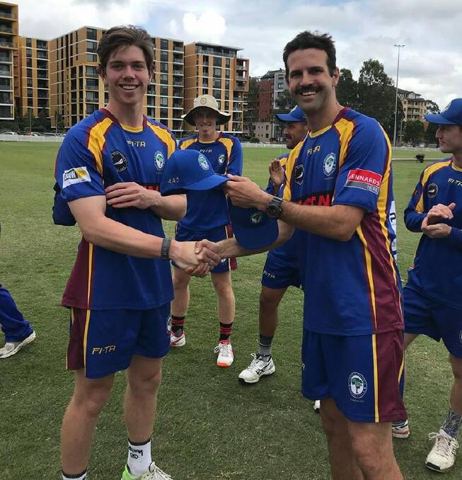 FIRST CAP: Will Fort (left) is presented with his first grade cap at Northern District.
