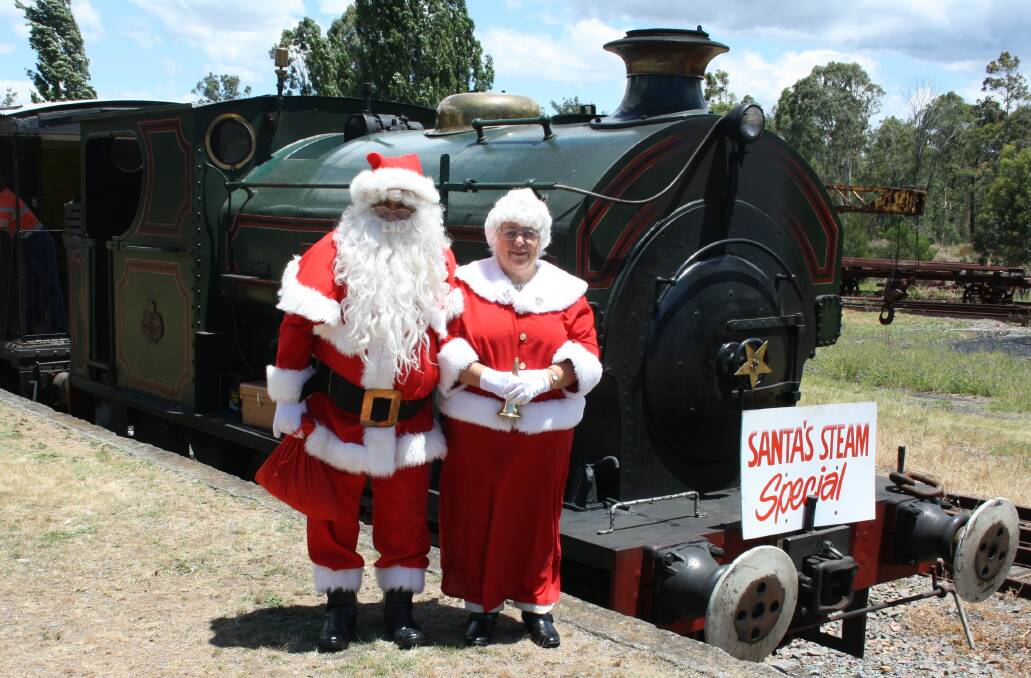 SPECIAL DAY: Santa and Mrs Claus on a previous visit to Richmond Vale Railway Museum. This year the man in red will arrive in a vintage fire truck (pictured below).