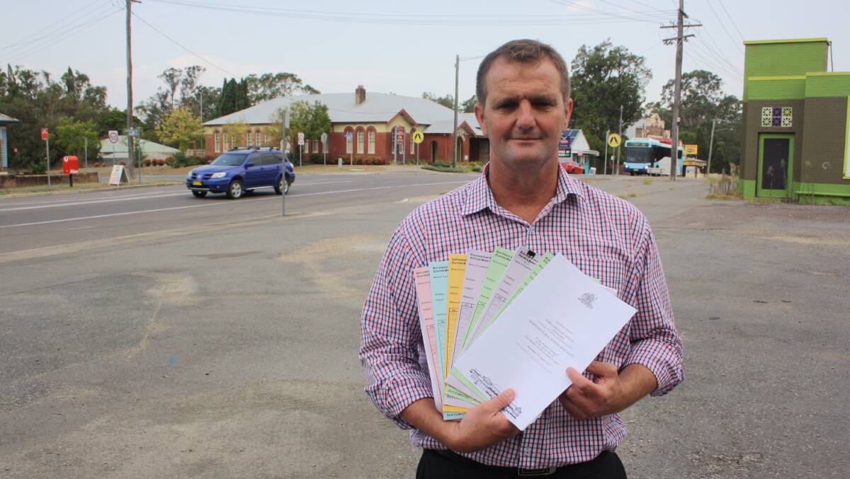 ADVOCATE: Clayton Barr, pictured in 2019 with some of the representations he had made about Cessnock Road over the years.