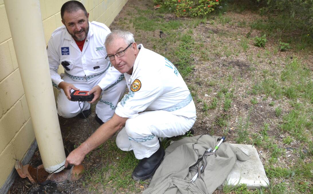 TECHNOLOGY: Cessnock District Rescue Squad volunteers James Harris and Chris Madgwick demonstrate the use of the Snap-On videoscope, which the squad uses to locate snakes. Picture: Krystal Sellars