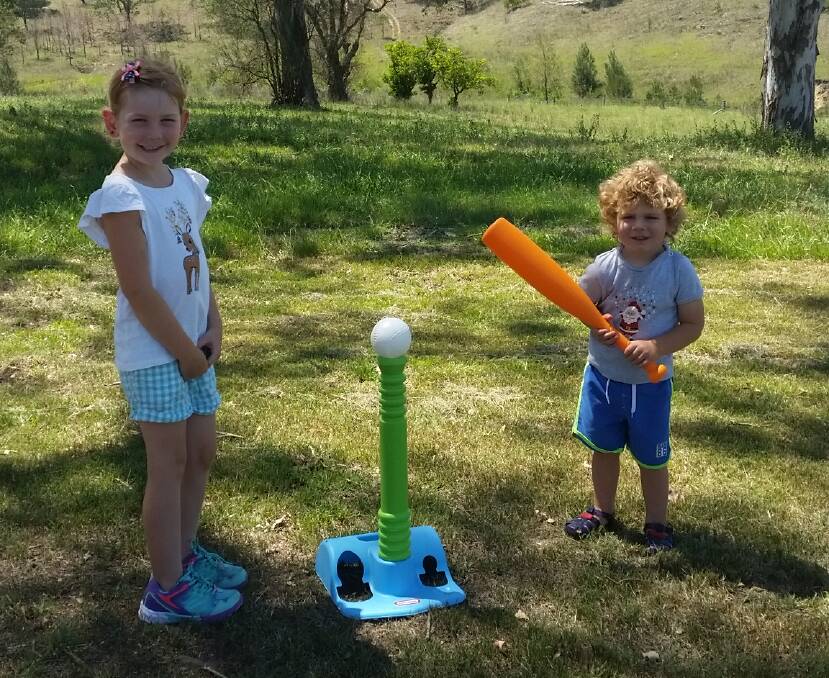 EXCITED: Gresford siblings Bridie and Oliver Booth with their new T-ball set, which was found in Richmond on Boxing Day. Picture: Kimberlee Booth