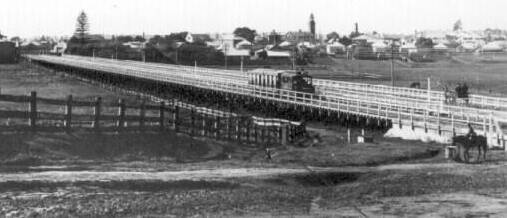 A tram bound for the Campbells Hill terminus steams across the Long Bridge at West Maitland.