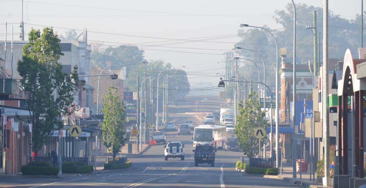 HAZE: Smoke from the state's bushfires drifts over Vincent Street, Cessnock on Tuesday morning. Picture: Krystal Sellars