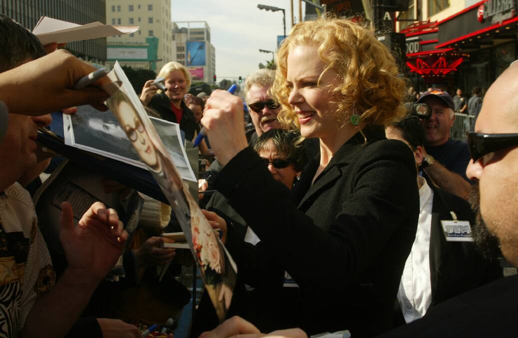 Power: Nicole Kidman signs autographs in 2003 when she won acclaim for her portrayal of Virginia Woolf in The Hours.   