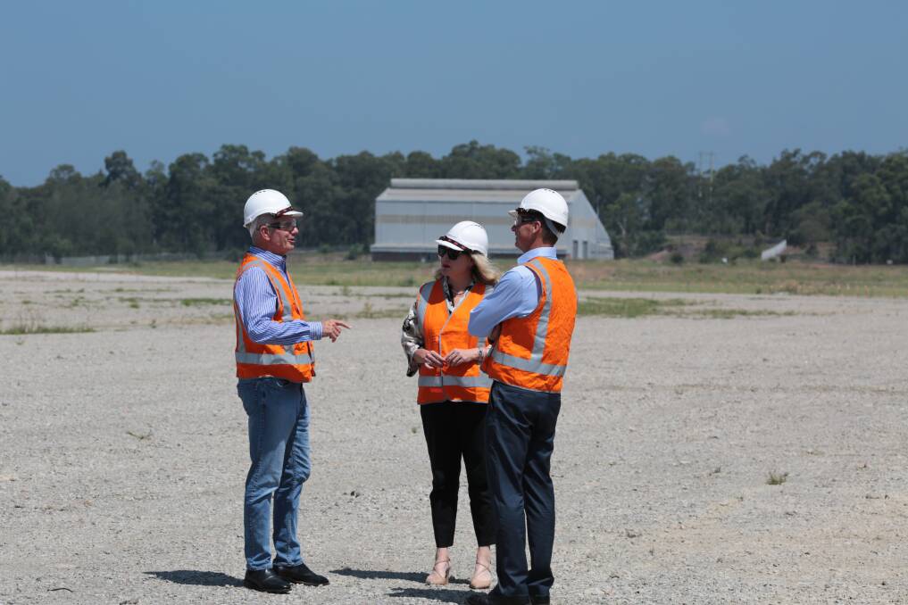 CLEARED FOR TAKEOFF: Paul Broad, Hollie Hughes and Angus Taylor on cleared land at Kurri where one of the demolished aluminium smelter's potlines once stood. Picture: Andrew Solomou, Hydro Aluminium Kurri Kurri 