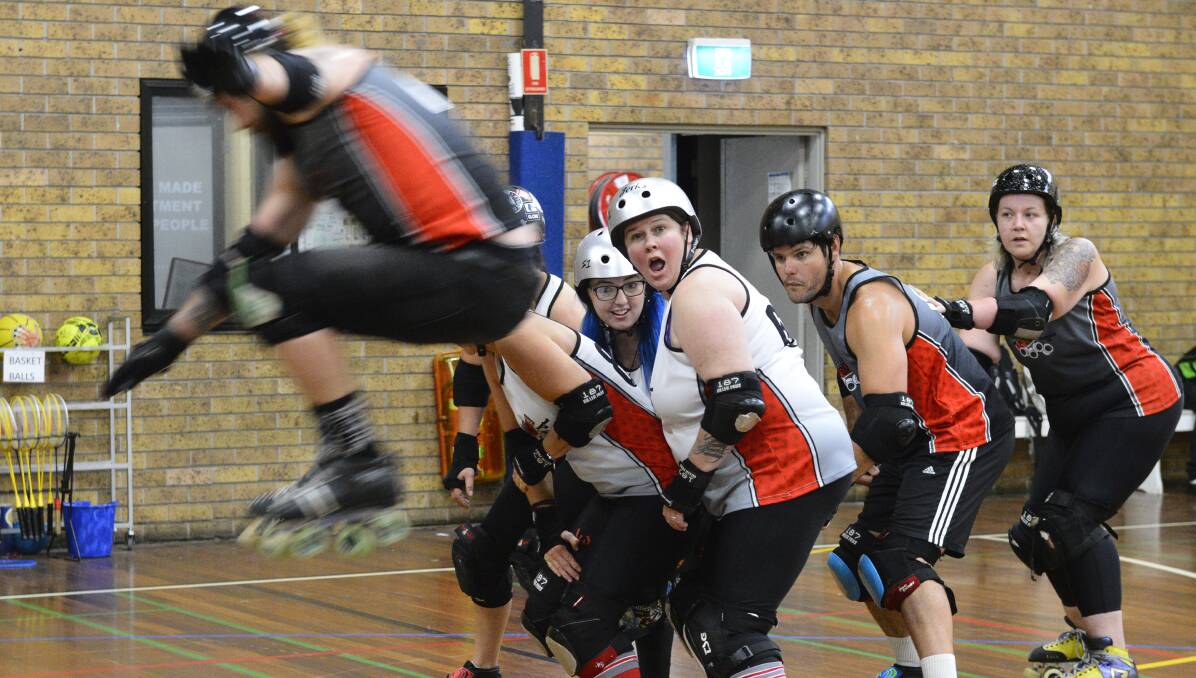 BIG AIR: Coach AJ Stephens jumps the apex during training with Maitland Roller Derby ahead of this weekend's big bout. Picture: Michael Hartshorn