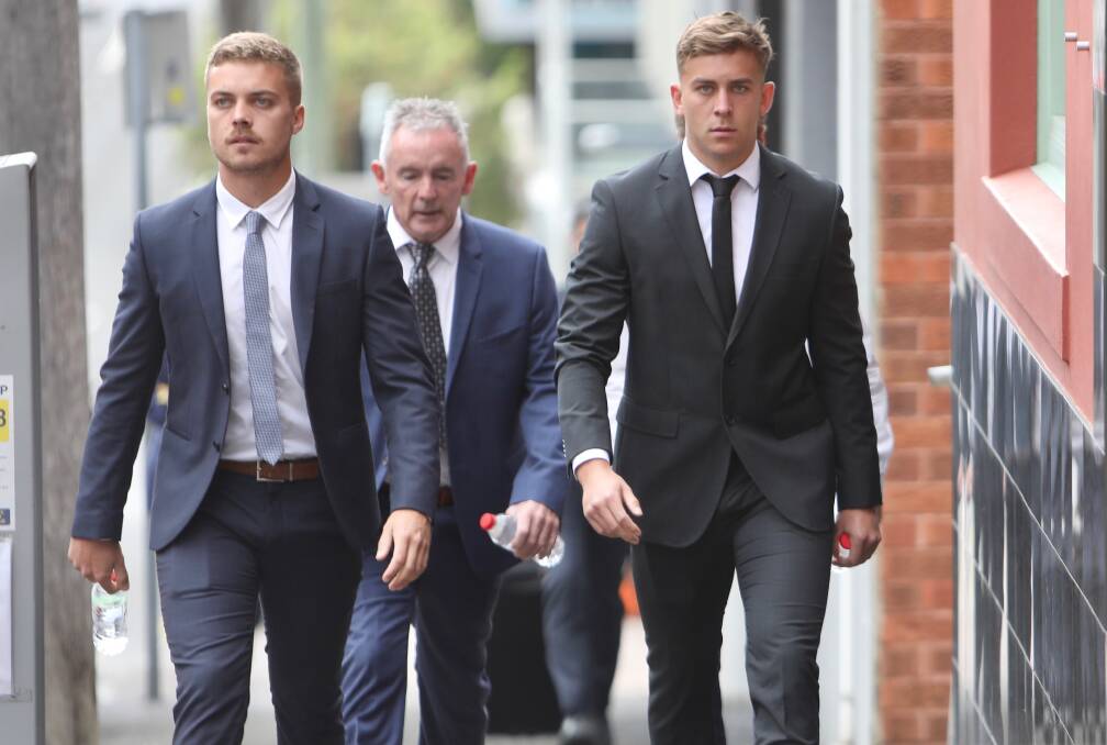 Callan Sinclair (right) on his way to Wollongong courthouse during the fourth week of his District Court trial for sexual assault. Picture: Adam McLean