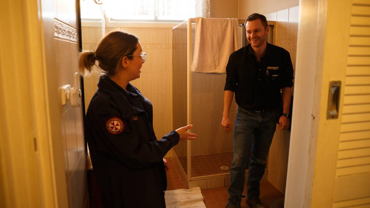 THE BIRTHING SUITE: Geoff shows Bec where the baby was born in the bathroom of their home in Kurri Kurri. Picture: Max Mason-Hubers 