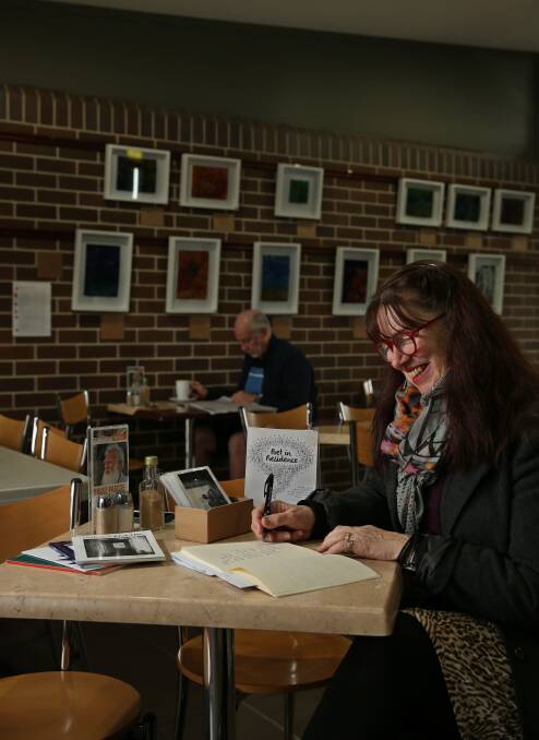 WRITING: Poet Pip Sheehan at Readers Cafe & Larder at East Maitland. Pip is one of the poets writing in public spaces around Maitland. Picture: Simone De Peak