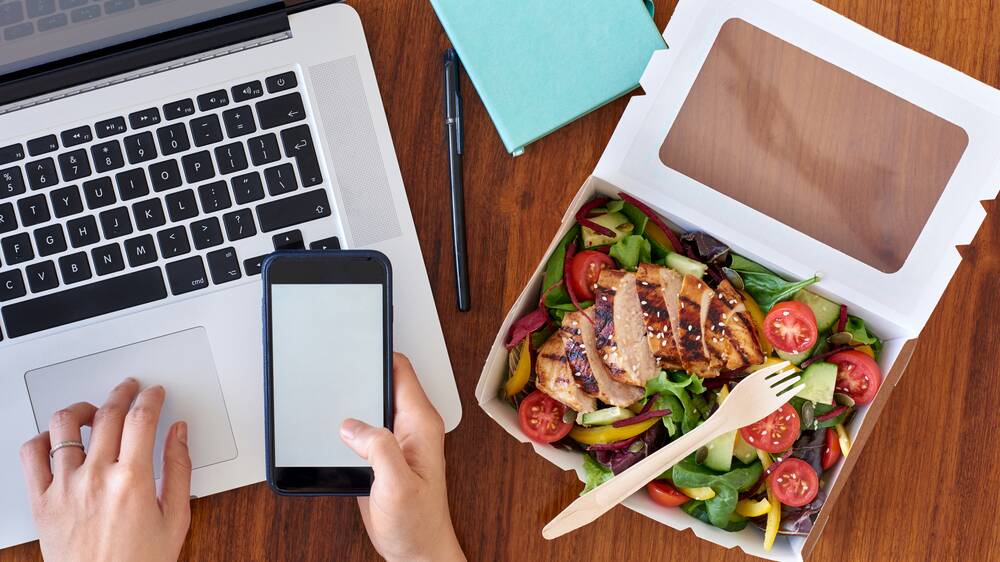 'Al desko' dining is becoming increasingly popular in the workplace. Picture: Shutterstock