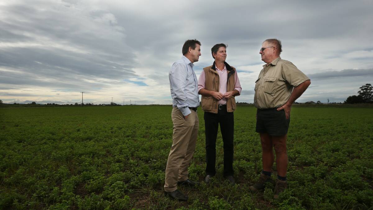 NSW Water Minister Kevin Anderson with Upper Hunter MP Dave Layzell and farmer Stephen Osborn in a lucerne paddock at Pitnacree. Picture: Simone De Peak