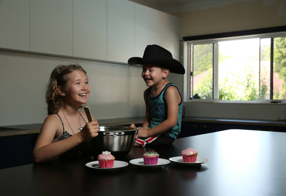 WINNER: Ruby Holdsworth and her brother Jacob, 5, in the kitchen with some of the cupcakes she made. Picture: Simone De Peak