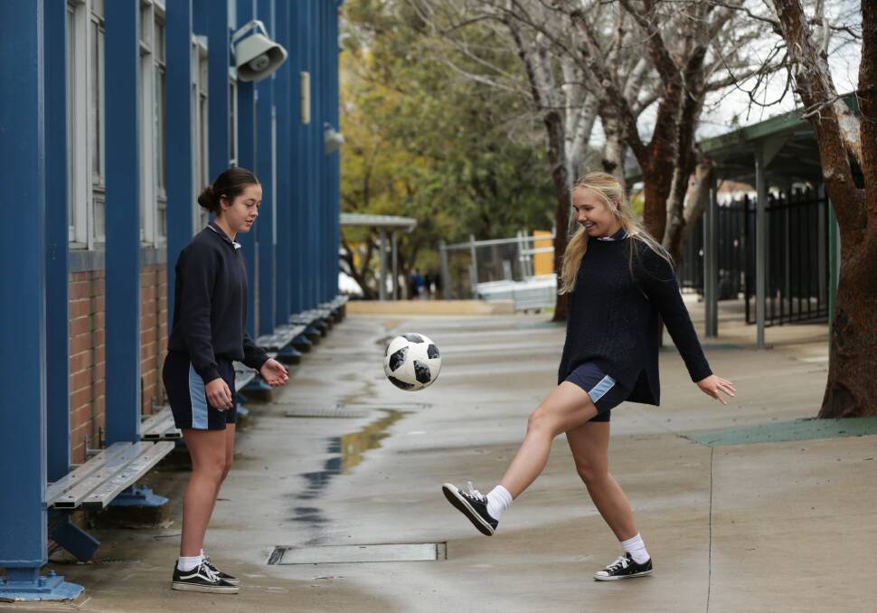 WORLD STAGE: Maitland Grossman High School year 9 students Josie Morley and Teagan Douglas will play for the Westfield Junior Matildas in central Asia this month. Picture: Simone De Peak.