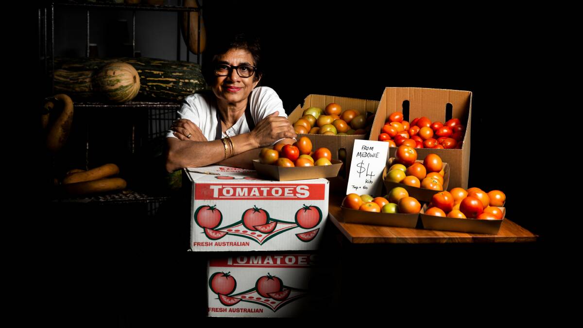 CHALLENGE: Slow Food Hunter Valley's Earth Market chairwoman Amorelle Dempster with some of the tomatoes. Picture: Marina Neil