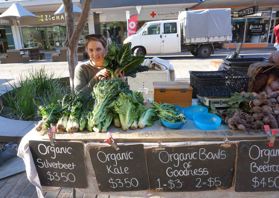 FIRST MARKET: Emma Fortunaso, of Mikor Farm at Chichester, with organic produce at the Slow Food Earth Market Maitland in The Levee.