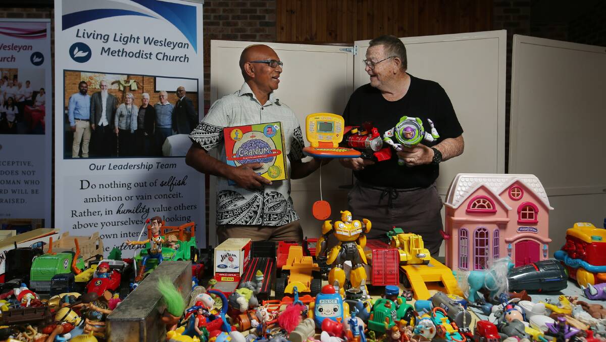 Living Light Wesleyan Methodist Church Pastor Manny Pillay and fundraising manager Michael Johnson with some of the toys. Picture by Simone De Peak 