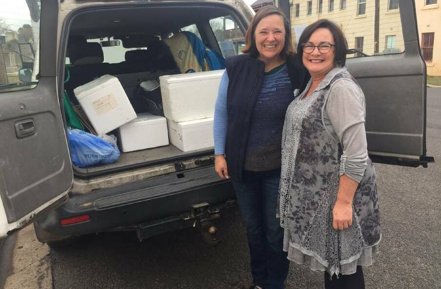 HAPPY TO HELP: We Care Road Trip founder Anne-Marie Best (right) was happy to fill the bus with fresh produce to help struggling farming families. 