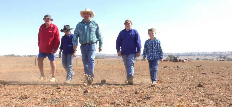FIGHT OF THEIR LIFE: John, Brooke, Chris, Thomas and Jack Haycock on their farm at Yeoval, which has been in their family for six generations.