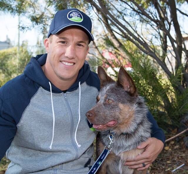 HELPING: Trent Hodkinson with one of the RSPCA dogs in need of a home. 