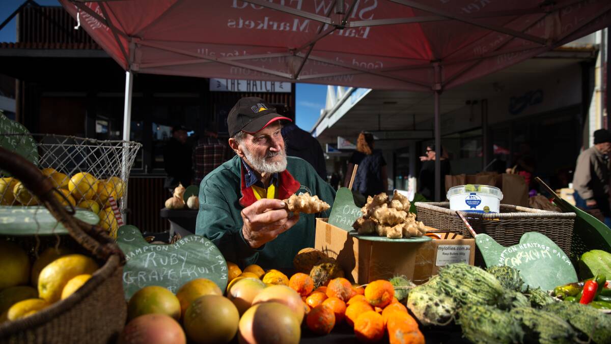 Farmer Austin Breiner holds a Jerusalem artichoke at his Slow Food Earth Market Maitland stall. Picture by Marina Neil