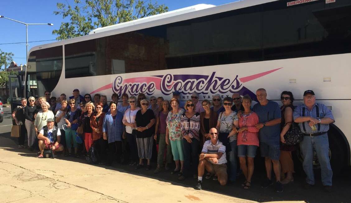 UNITED: The group who took part in the We Care Road Trip pose for a photo. Grace Coaches donated a bus and a driver for the event.
