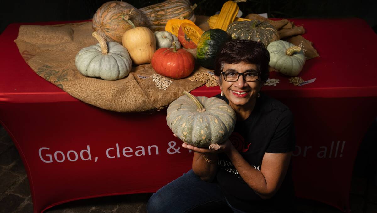 Earth Market Maitland chairwoman Amorelle Dempster with some of the pumpkins grown in the Maitland area, and their seeds. Picture by Marina Neil 