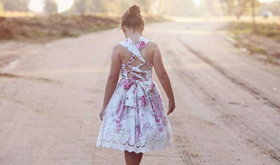 DIVERSIFYING: Cathy French's daughter Liana Reed wearing one of her handmade dresses at their farm in southern NSW.