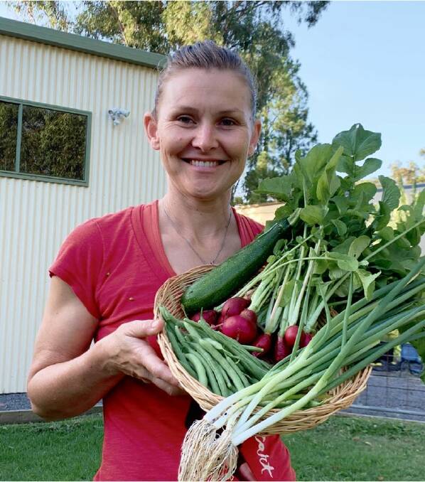 FARM FRESH: Blue Boat Farm Gate's Melissa Fogarty with her $10 mixed bunch.