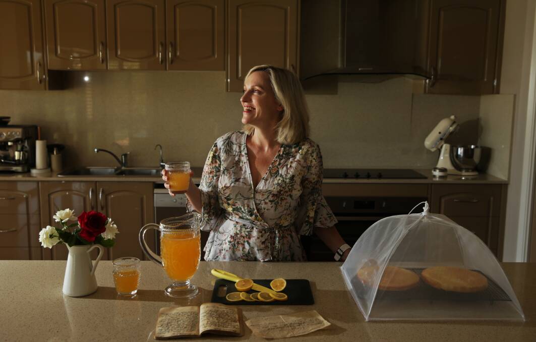 OLD WORLD CHARM: Blogger Libby Hakim holds a jug of Ceylon Punch in her kitchen at Louth Park. Picture: Simone De Peak