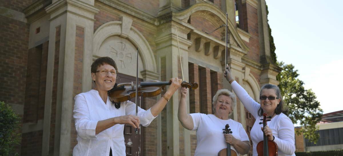 ORCHESTRA: Violinists Carolyn Gregg, Helen Russell and Sally Keir will perform with the city's orchestra, called Maitland Musical Society, this weekend. 