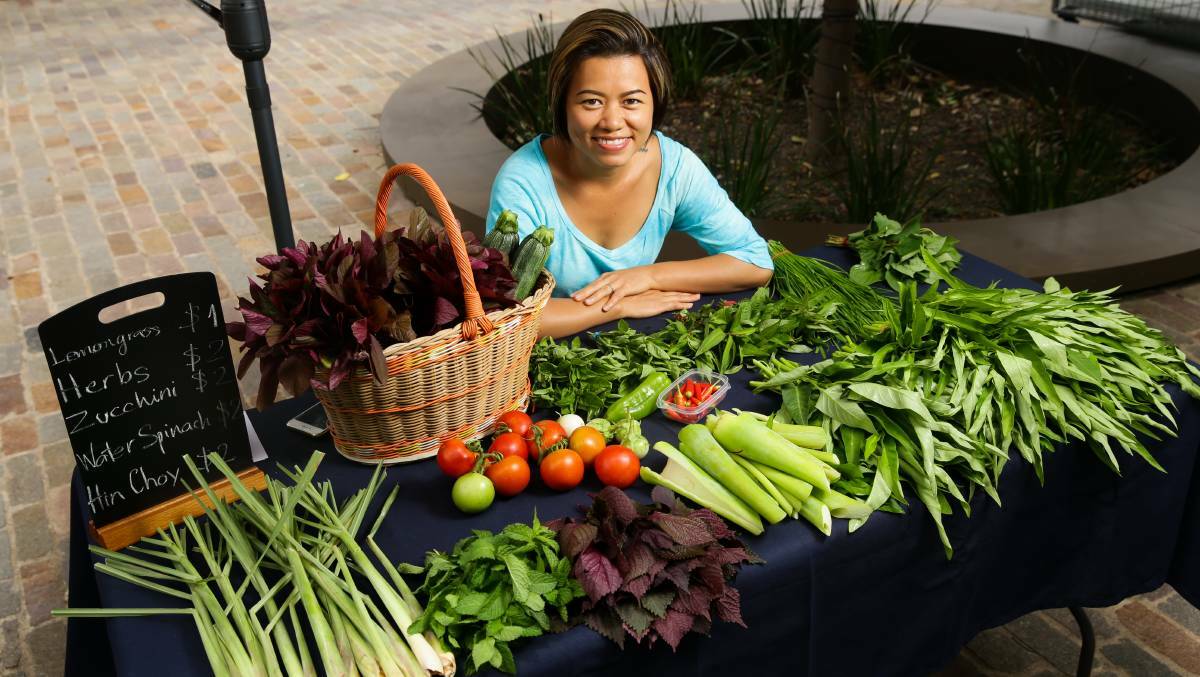 NEW FLAVOURS: Backyard grower Felicia Nguyen with some of her produce. 